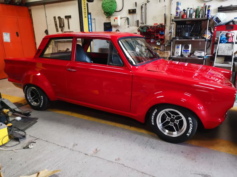 Red Painted Cortina full side